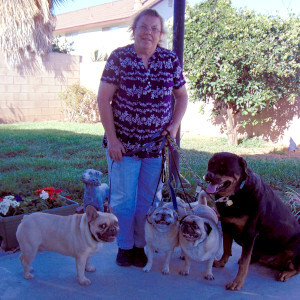 Woman with 4 dogs.