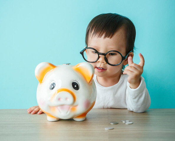 Baby with piggy bank